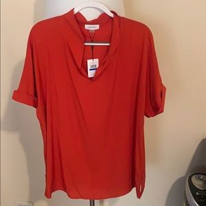 Unworn Orange Calvin Klein blouse